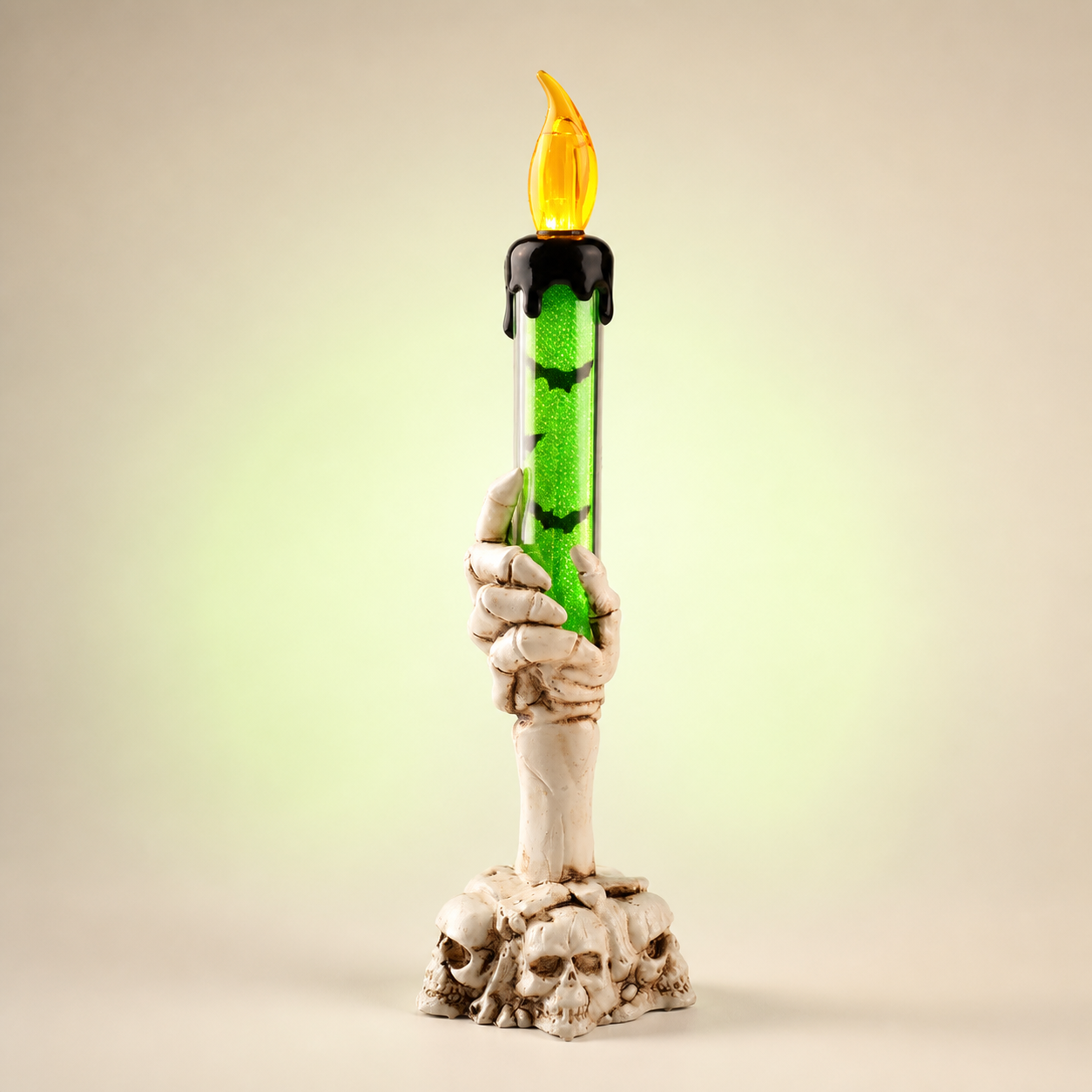 Tall ivory skeleton-hand LED candle light with green glitter tube
